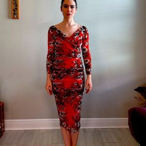 Fuzzi stretch dress. Made in Italy.Orange floral print. Ruched.Long sleeve.Midi.